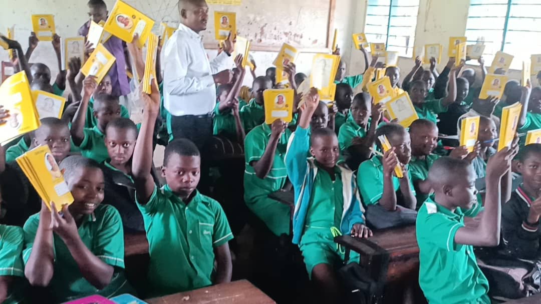 Hon. Nambozo Brings Hope to Sironko Township Primary School with Book Distribution